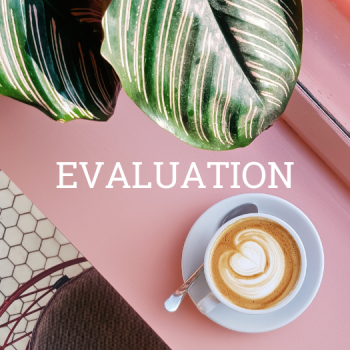 "Evaluation" text with coffee cup and plant leaf on pink desk